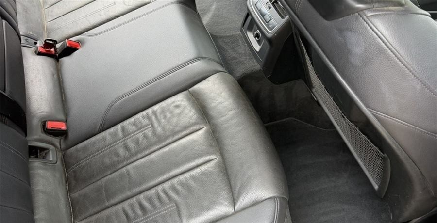 The same back seat after detailing, cleaned down to the stitching